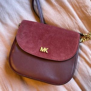 Maroon/red wine crossbody Michael Kors bag. Never worn/used. Pristine condition